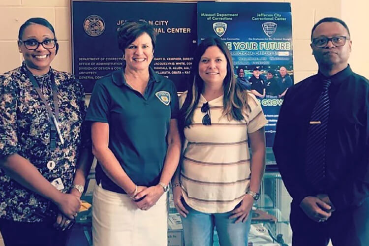 DOC Pictured are: JCCC Warden Doris Falkenrath, DOC Director Anne Precythe, MOSERS Executive Director Abby Spieler, and Deputy Warden Billy Dunbar.