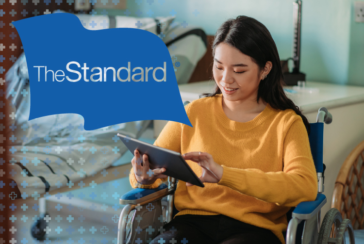"The Standard" over a woman in a wheelchair who is viewing information on a tablet.