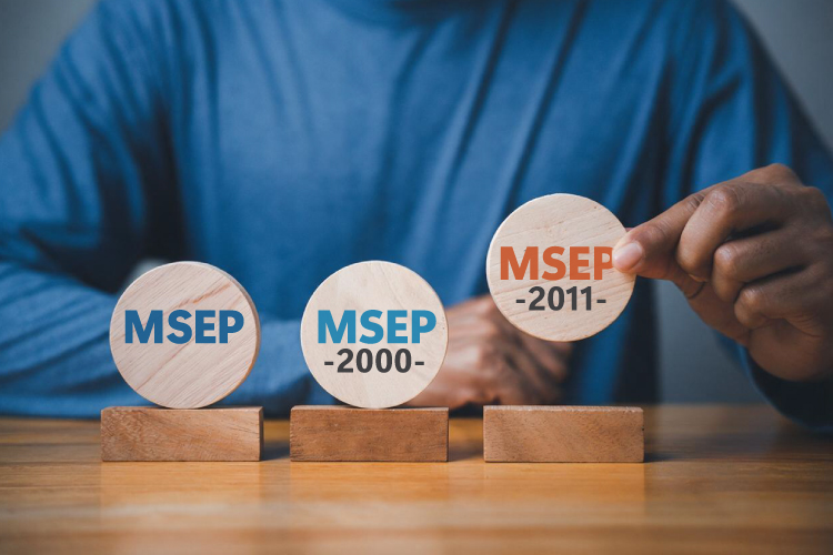 MSEP, MSEP 2000, and MSEP 2011 plans displayed on round tokens with person holding up the MSEP 2011 token.